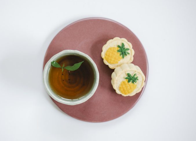 loose leaf tea with cookies on a plate